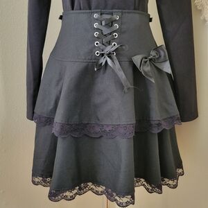 Thorn & Fable | Goth Tiered Black Lace-Up Bow Mini Skirt